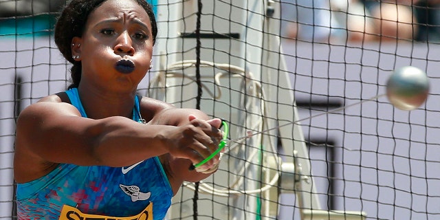 FILE - In this Sunday, May 21, 2017, file photo, Gwen Berry, of the United States, competes in the women's hammer throw at the Golden Grand Prix track and field event in Kawasaki, Japan. Gestures made at the Pan-Am Games in 2019 by Berry and fencer Race Imboden rekindled a contentious debate about the IOC's Rule 50. In a major shift in policy, the U.S. Olympic and Paralympic Committee has since committed to not sanction athletes who use their platform for social demonstrations. (AP Photo/Shizuo Kambayashi, File)