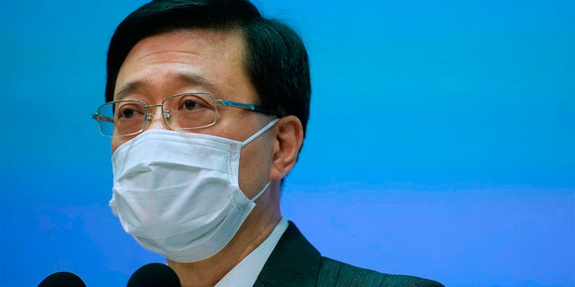 Hong Kong Secretary for Security, John Lee listens to questions during a press conference in Hong Kong, Thursday, June 17, 2021. (AP Photo/Vincent Yu)