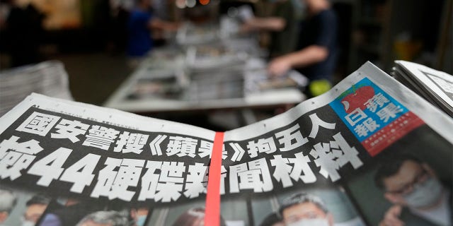 Copies of Apple Daily newspaper are packed at the printing house in Hong Kong, early Friday, June 18, 2021.