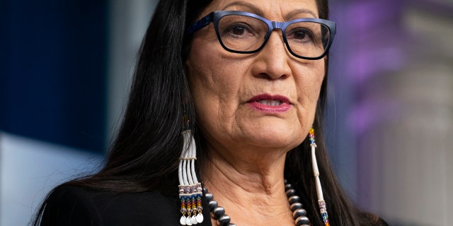 FILE - In this April 23, 2021, file photo, Interior Secretary Deb Haaland speaks during a news briefing at the White House in Washington. On Tuesday, June 22, 2021, Haaland and other federal officials are expected to announce steps that the federal government plans to take to reconcile the legacy of boarding school policies on Indigenous families and communities across the U.S. (AP Photo/Evan Vucci, File)