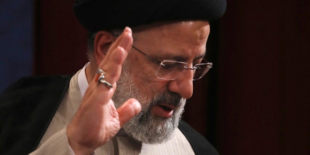 In this June 21, 2021, photo, Iran's new President-elect Ebrahim Raisi waves at the conclusion of his news conference in Tehran, Iran. (AP Photo/Vahid Salemi)