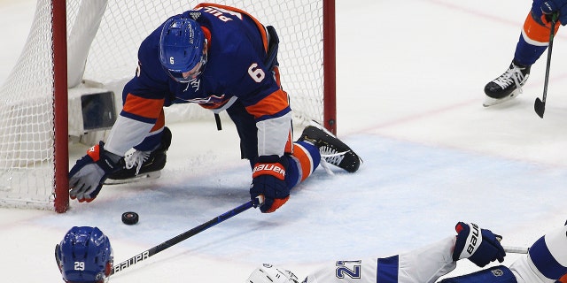 New York Islanders defenseman Ryan Pulock (6) makes a last second save to secure the victory against the Tampa Bay Lightning during the third period of game four of the 2021 Stanley Cup Semifinals at Nassau Veterans Memorial Coliseum, June 19, 2021. (USA TODAY Sports)