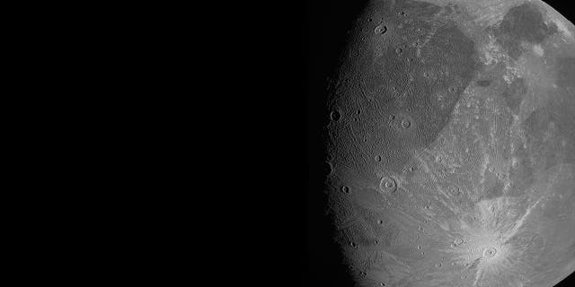 This June 7, 2021 image made available by NASA shows the Jovian moon Ganymede as the Juno spacecraft flies by. "This is the closest any spacecraft has come to this mammoth moon in a generation," said Juno's lead scientist, Scott Bolton of the Southwest Research Institute in San Antonio. (NASA/JPL-Caltech/SwRI/MSSS via AP)