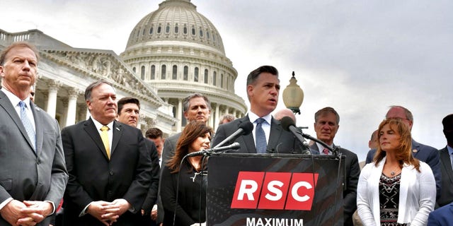 Rep.Jim Banks of Indiana, the chair of the Republican Study Committee, and other members of the conservative caucus, hold a news conference outside the U.S. Capitol, in April of 2021.