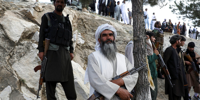 Afghan militiamen join Afghan defense and security forces during a gathering in Kabul, Afghanistan, Wednesday, June 23, 2021.