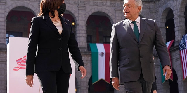 Vice President Kamala Harris walks with Mexican President Andres Manuel Lopez Obrador, Tuesday, June 8, 2021, at the National Palace in Mexico City. (AP Photo/Jacquelyn Martin)