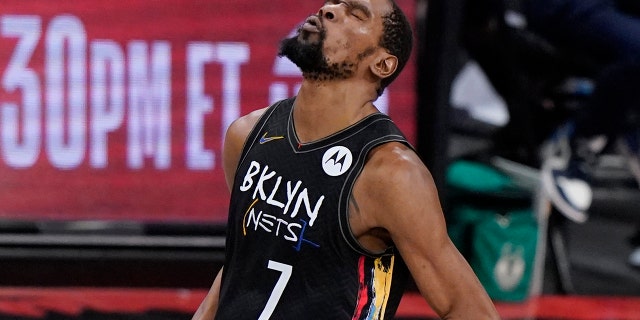 Brooklyn Nets forward Kevin Durant reacts after sinking a 3-point shot against the Milwaukee Bucks during the fourth quarter of Game 5 of a second-round NBA basketball playoff series Tuesday, June 15, 2021, in New York. (AP Photo/Kathy Willens)