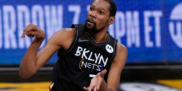 Brooklyn Nets forward Kevin Durant watches as he sinks a three-point shot during the fourth quarter of Game 5 of a second-round NBA basketball playoff series against the Milwaukee Bucks, Tuesday, June 15, 2021, in New York.