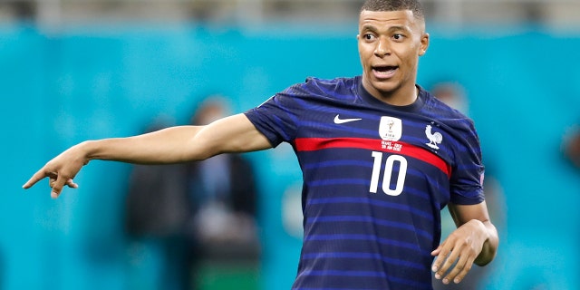 France's Kylian Mbappe reacts after missing a scoring chance the Euro 2020 soccer championship round of 16 match between France and Switzerland at the National Arena stadium in Bucharest, Romania, Tuesday, June 29, 2021.