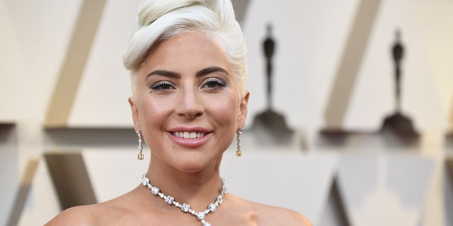 Lady Gaga took to Instagram on Saturday to share a pair of brief videos, which featured the star posing in the grass as she rocked a plunging pink camisole and seemingly no pants. (Photo by Frazer Harrison/Getty Images)