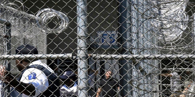 In this Wednesday, April 10, 2019 file photo, Prison staff work at Lee Correctional Institution in Bishopville, S.C. (AP Photo/Meg Kinnard)