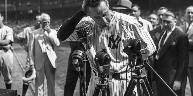 Lou Gehrig #4 of the New York Yankees is shown before the mic delivering his farewell speech on Lou Gehrig Day on July 4, 1939 at Yankee Stadium in the Bronx, New York. 