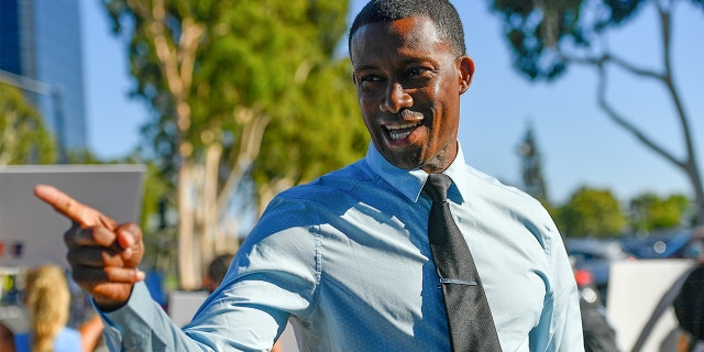 FILE: Major Williams, a candidate for a California Governor, visits with people protesting coronavirus (COVID-19) salon closures by California Governor Gavin Newsom.
