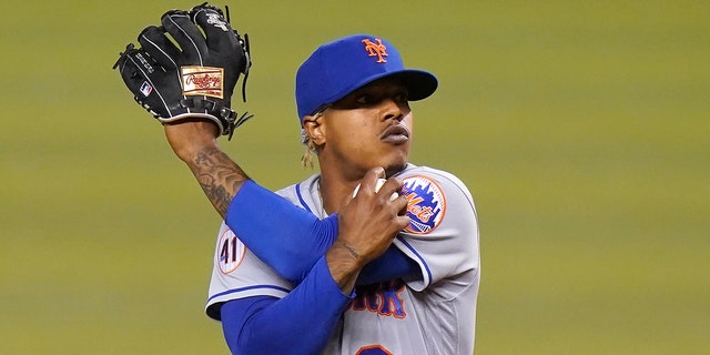 New York Mets starting pitcher Marcus Stroman stretches after giving up a single to Miami Marlin Jazz Chisholm Jr. during the first inning of a game May 21, 2021, in Miami. 