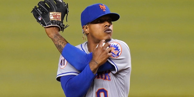 New York Mets starting pitcher Marcus Stroman stretches after giving up a single to Miami Marlin Jazz Chisholm Jr. during the first inning of a game May 21, 2021, in Miami.