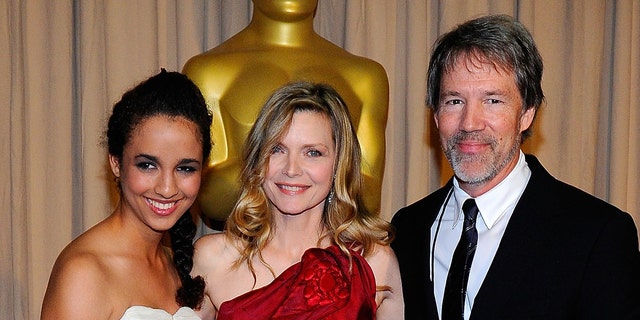 Michelle Pfeiffer (center) with her husband David E. Kelley and daughter Claudia Rose at the 2010 Academy Awards.  (Photo by Kevork Djansezian/Getty Images)