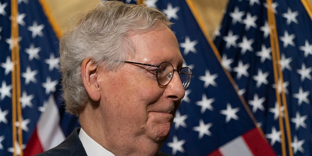 Senate Minority Leader Mitch McConnell of Ky., departs after speaking with reporters after a Republican caucus luncheon on Capitol Hill, Tuesday, June 8, 2021, in Washington. (AP Photo/Alex Brandon)