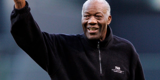 Former MLB pitcher Jim "Mudcat" Grant waves to the crowd before throwing out the ceremonial pitch before the Indians host the Boston Red Sox in Cleveland, April 14, 2008. (Associated Press)