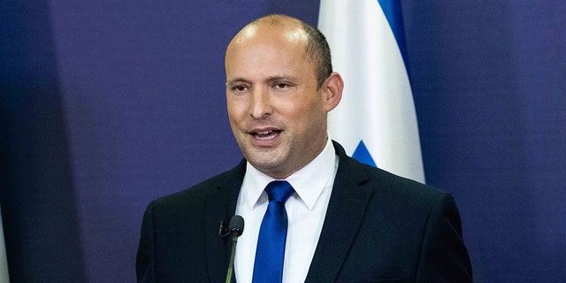 Yemina party leader Naftali Bennett speaks to the Israeli Parliament in Jerusalem, Sunday, May 30, 2021. 