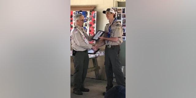 Mychal VanAllsburg getting the Heroism Award for saving Jodie Matthews in the 2018 crash.