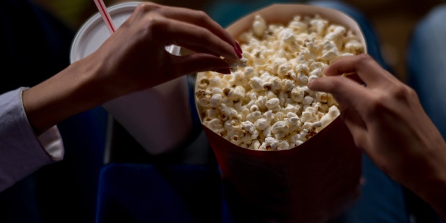 TikTok user Colleen Lepp posted a video showing people how to make sure butter gets all throughout their popcorn buckets, rather than just on the top. (iStock)