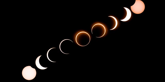 TOPSHOT - This composite image shows the moon as it moves in front of the sun in a rare "ring of fire" solar eclipse as seen from Tanjung Piai in Malaysia on December 26, 2019. (Photo by Sadiq ASYRAF / AFP) (Photo by SADIQ ASYRAF/AFP via Getty Images)