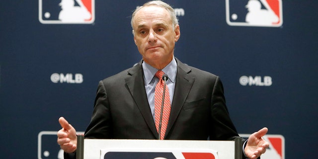 In this Nov. 21, 2019 file photo, Baseball Commissioner Rob Manfred speaks to the media at the owners meeting in Arlington, Texas.