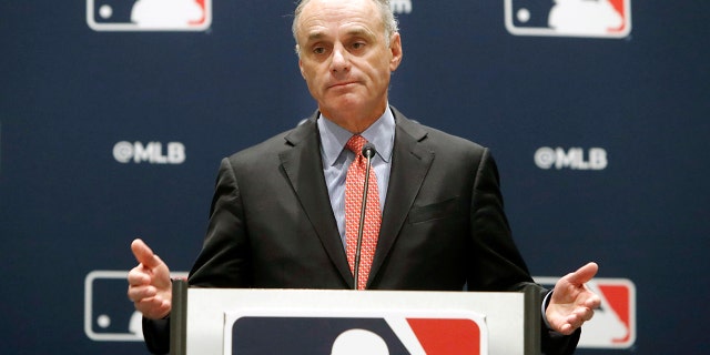 In this November 21, 2019 file photo, Baseball Commissioner Rob Manfred speaks to the media at an owners conference in Arlington, Texas.