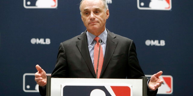 In this Nov. 21, 2019 file photo, Baseball Commissioner Rob Manfred speaks to the media at the owners meeting in Arlington, Texas.