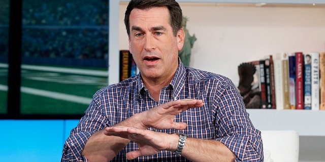 Rob Riggle believes his estranged wife spied on him with a hidden camera.