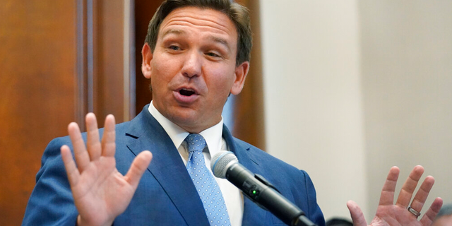 Florida Gov. Ron DeSantis gestures as he speaks, Monday, June 14, 2021, at the Shul of Bal Harbour, a Jewish community center in Surfside, Fla.