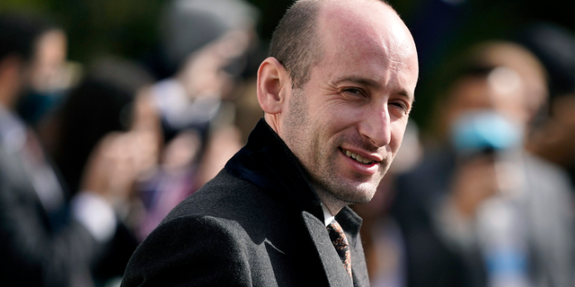 In this Oct. 30, 2020 file photo, President Donald Trump's White House Senior Adviser Stephen Miller follows President Donald Trump on the South Lawn of the White House in Washington.