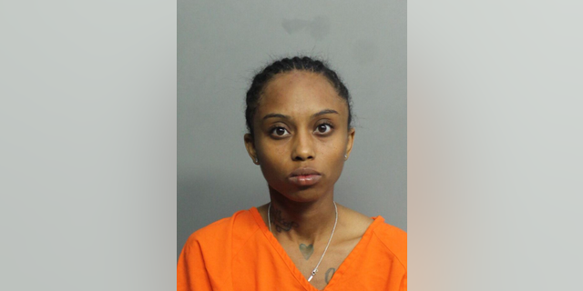 Taniyria Holt, 24, is accused of accidentally shooting her teenage sister in the head while riding in a car Sunday night. 