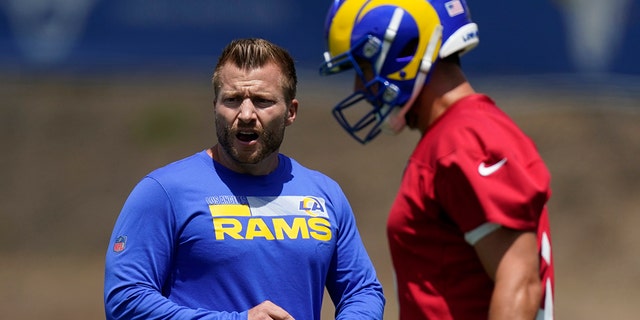 Los Angeles Rams head coach Sean McVay, left, talks to quarterback Matthew Stafford during an NFL football practice Tuesday, June 8, 2021, in Thousand Oaks, Calif.