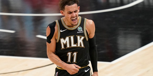 Atlanta Hawks' Trae Young reacts after he scores during the second half of Game 4 of a second-round NBA basketball playoff series against the Philadelphia 76ers on Monday, June 14, 2021, in Atlanta. (AP Photo/Brynn Anderson)