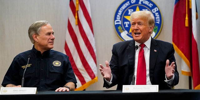 Texas Gov. Greg Abbott and former President Donald Trump attend a briefing with state officials and law enforcement at the Weslaco Department of Public Safety DPS Headquarters before touring the US-Mexico border wall on Wednesday, June 30, 2021 in Weslaco, Texas.