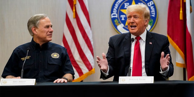 Texas Gov. Greg Abbott and former President Donald Trump attend a briefing with state officials and law enforcement at the Weslaco Department of Public Safety DPS Headquarters before touring the US-Mexico border wall on Wednesday, June 30, 2021 in Weslaco, Texas.