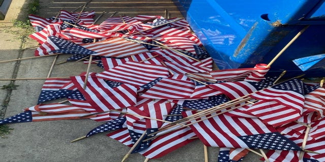 Some of the flags were left near a dumpster. (Courtesy VFW Post & Auxiliary #1138)