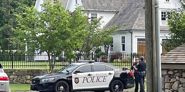 Westport, Connecticut, police officers are seen Friday outside a home where a mother and daughter were found dead Thursday. (Connor Ryan/Fox News)