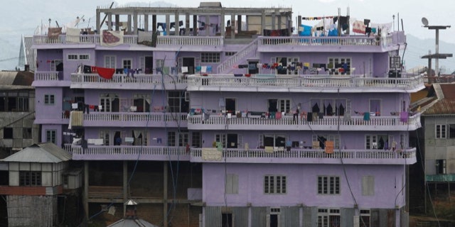 FILE PHOTO: A view of Ziona's 4 storey house in Baktawng village in the northeastern Indian state of Mizoram, October 6, 2011. REUTERS/Adnan Abidi