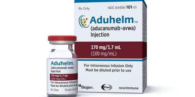 This image provided by Biogen on Monday, June 7, 2021 shows a vial and packaging for the drug Aduhelm. On Monday, June 7, 2021, the Food and Drug Administration approved Aduhelm, the first new medication for Alzheimer’s disease in nearly 20 years, disregarding warnings from independent advisers that the much-debated treatment hasn’t been shown to help slow the brain-destroying disease. (Biogen via AP)