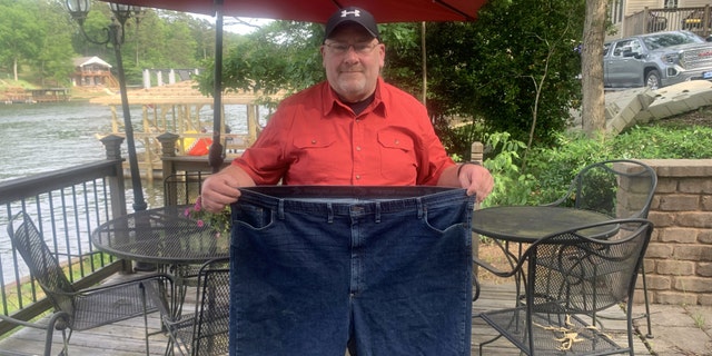 Before he started gaining weight, Moore (pictured) was a personal trainer. However, after becoming a single dad and after both his parents died, Moore spent years gaining weight, eventually reaching 443 pounds.