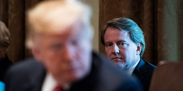 White House Counsel Don McGahn listens as President Trump speaks during a cabinet meeting in the Cabinet Room of the White House Oct. 17, 2018.
