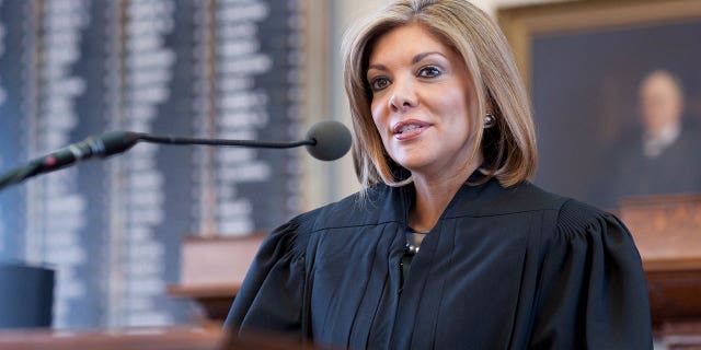 Texas Supreme Court justice, Eva Guzman of Houston, is sworn into office by Texas Governor Rick Perry in ceremonies at the Texas Capitol.