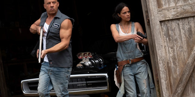 This image released by Universal Pictures shows Vin Diesel, left, and Michelle Rodriguez in a scene from "F9: The Fast Saga."