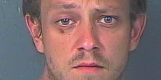 Joseph Charles Strickland, 28, of Weeki Wachee, was traveling on a road north of Tampa early Sunday when his car struck the unidentified pedestrian, 32, who was walking along the roadway