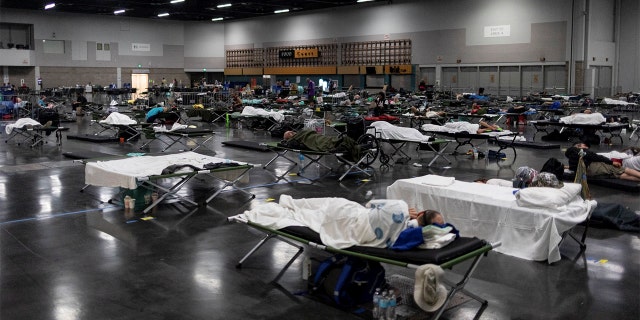 People sleep at a cooling shelter set up during an unprecedented heat wave in Portland, Oregon, U.S. June 27, 2021. (REUTERS/Maranie Staab)