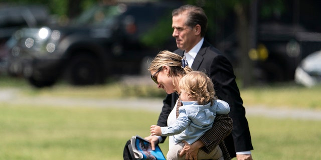 Hunter Biden, Melissa Cohen and baby Beau Biden walk to Marine One upon departure from the White House, May 22, 2021, in Washington. (AP File Photo/Alex Brandon)