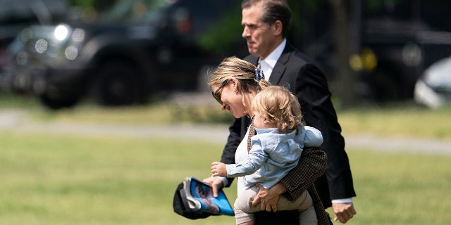 Hunter Biden, Melissa Cohen and baby Beau Biden walk to Marine One upon departure from the White House, May 22, 2021, in Washington. (AP File Photo/Alex Brandon)