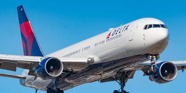 The Delta traveler said he got up and tried to assist another passenger. 